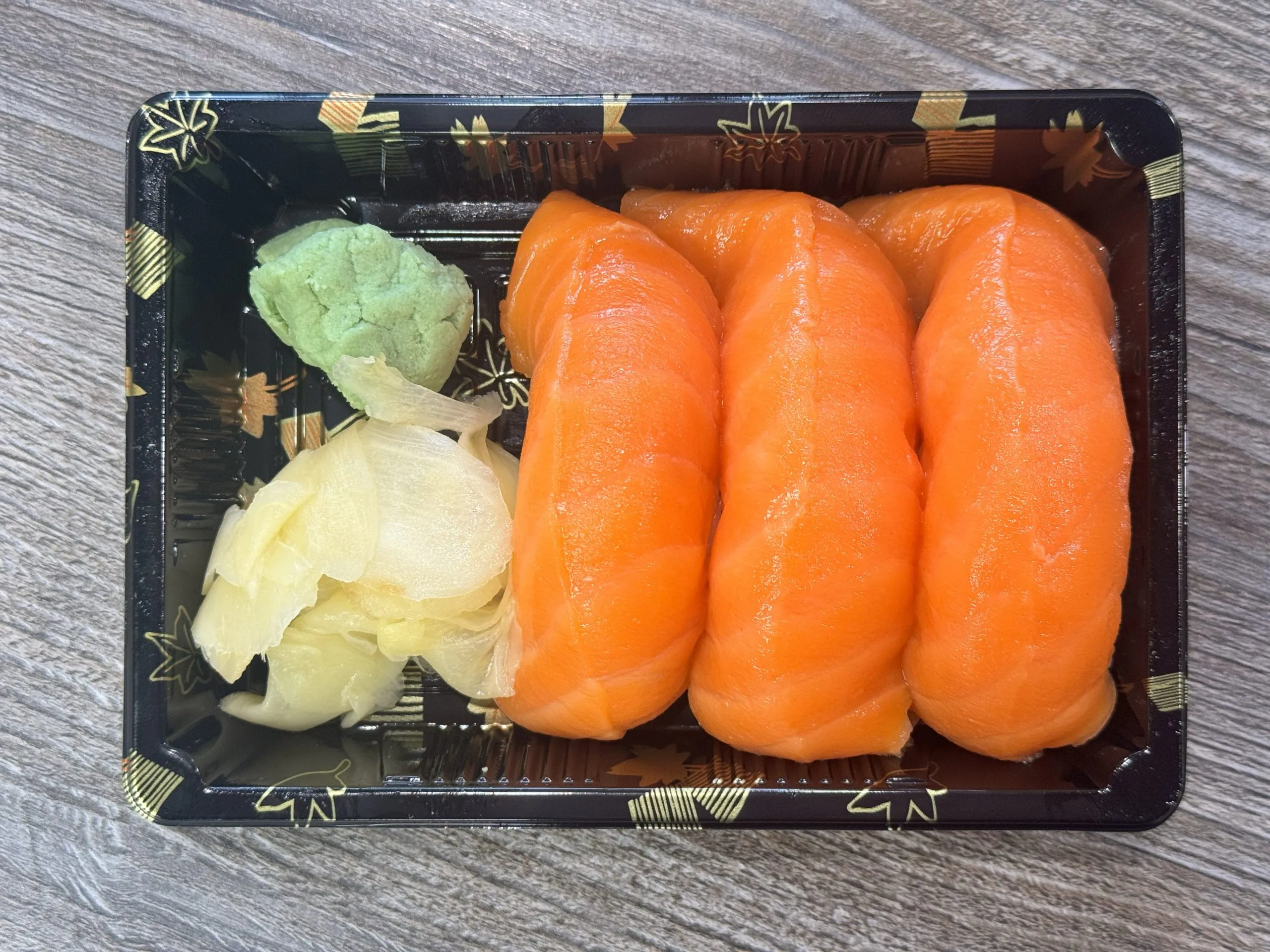 Fresh salmon nigiri with wasabi and ginger at Chop Sushi & Grill, a Japanese Restaurant in Los Angeles
